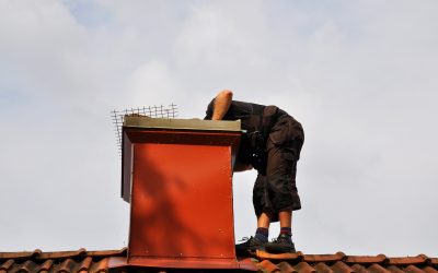 Unrecognizable,Modern,Chimney,Sweep,Checking,Out,The,Chimney,From,The